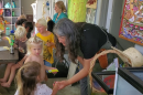 Liberty Winn works with kids at her childcare center in Carlsbad, May 18, 2022.