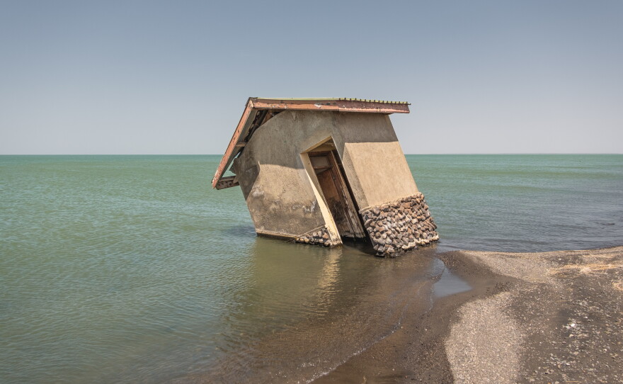 A building is seen collapsing into the waters of Lake Turkana at a ranger station on the northeastern shore of the lake. The building stood hundreds of feet from the edge of the lake until rising water levels encroached. Around the lake, huge tracts of land have been submerged, affecting fishermen, communities, businesses and even some of the world's most important hominid fossil sites.
