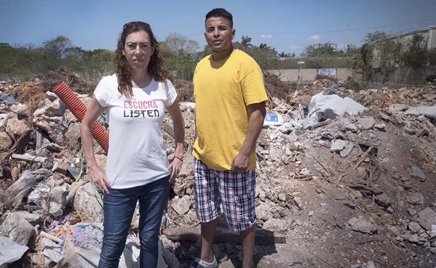 Elizabeth and Marcos standing amidst the rubble in the Yucatan.