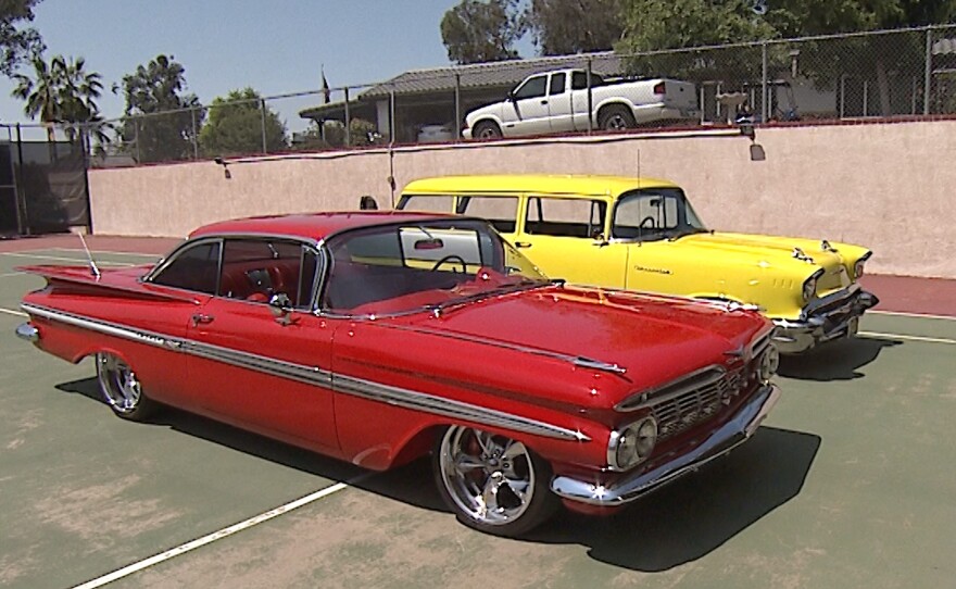 Pictured, a red 1959 Chevy Impala and a yellow 1957 Chevy Handyman Wagon parked in Escondido. June 17, 2021.