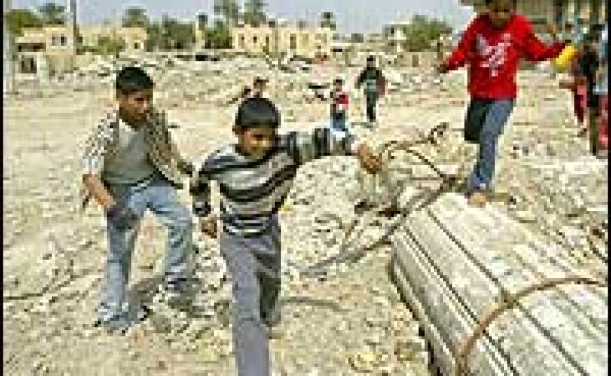 Iraqi children play inside the premises of the destroyed Iraqi Air Force Club. Scores of displaced people are still living among the ruins of the club once a luxurious home to the elite of former dictator Saddam Hussein's regime.