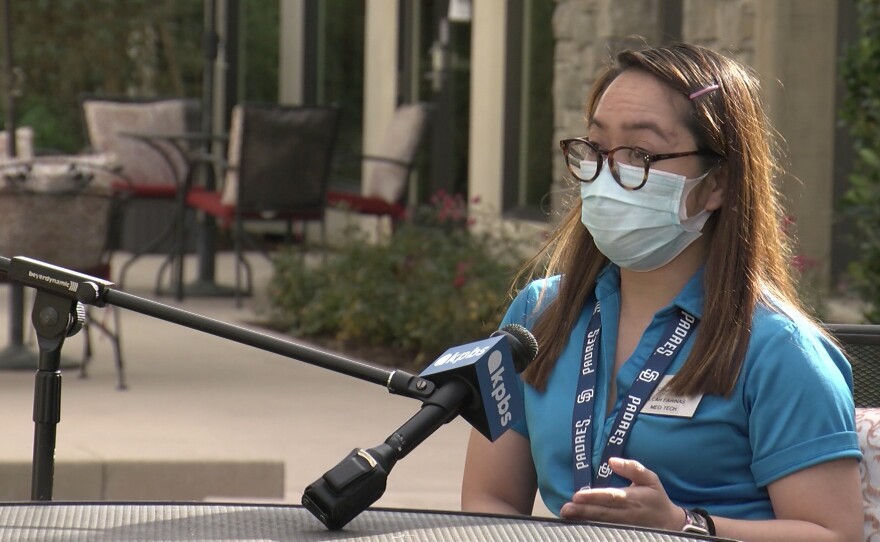 Caregiver Leah Farinas speaks in the backyard of Villa Lorena, a San Diego assisted living facility where she works, December 2020.