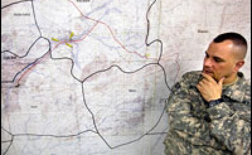 U.S. Navy Cmdr. Benjamin Nicholson talks about the incident in the village of Garani. Some of the wounded villagers were brought into the Provincial Reconstruction Team's hospital on the base before being transported to Herat and Kandahar.