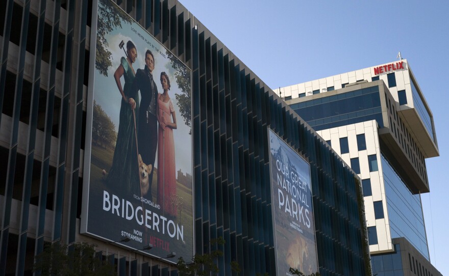 An advertisement for Netflix's popular show <em>Bridgerton</em> is seen outside its office building in Los Angeles, in April.