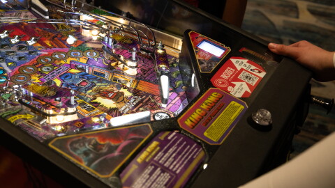 A man plays "King Kong" pinball at Stern Pinball’s Pop-Up Arcade during Comic-Con in San Diego on July 24, 2026.