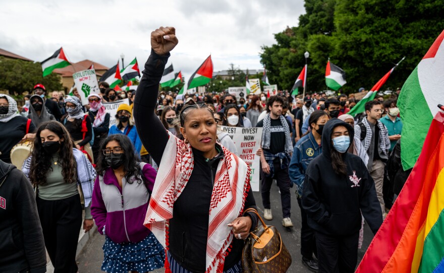 Pro-Palestinian demonstrators march through the Stanford University campus in Stanford, Calif., on April 25, 2024, calling for the university to divest from Israel. The rally took place during Stanford's Admit Weekend, a time for incoming students to tour the university.