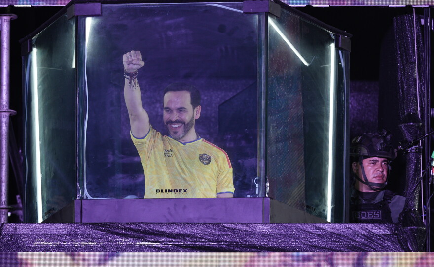 Presidential candidate Abelardo de la Espriella of the opposition Defenders of the Motherland movement speaks to supporters from inside a bulletproof booth at a celebration rally after runoff election results showed him leading in Barranquilla, Colombia, Sunday, June 21, 2026.