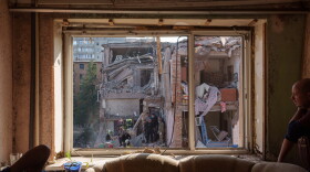 Locals and rescuers clear the rubble of a residential building destroyed in a Russian missile strike on Pryluky, Ukraine, Wednesday, Oct. 7, 2026.
