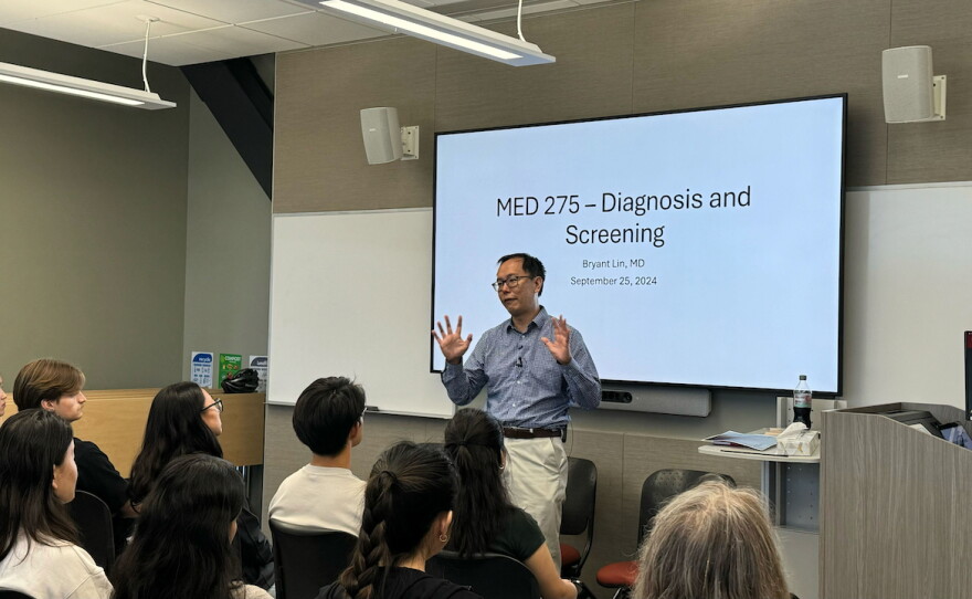 Dr. Bryant Lin teaches a lung cancer class in fall 2024. He says he was very nervous to teach the first class and share his story.