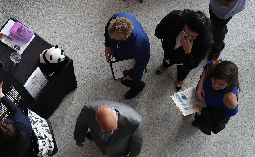 People attend the JobNewsUSA career fair Sunrise, Fla., in November 2016.