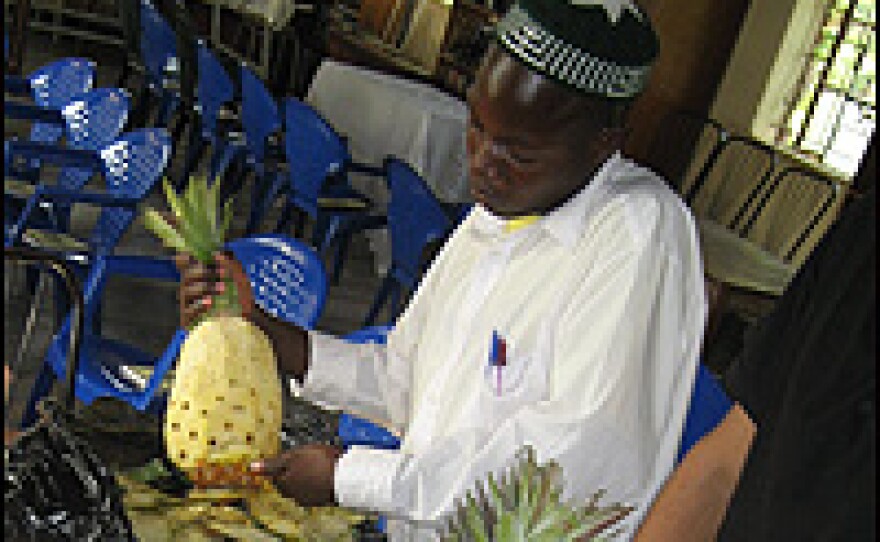 A member of Uganda's Abayudaya community prepares a dish called haroset for the Passover celebration.