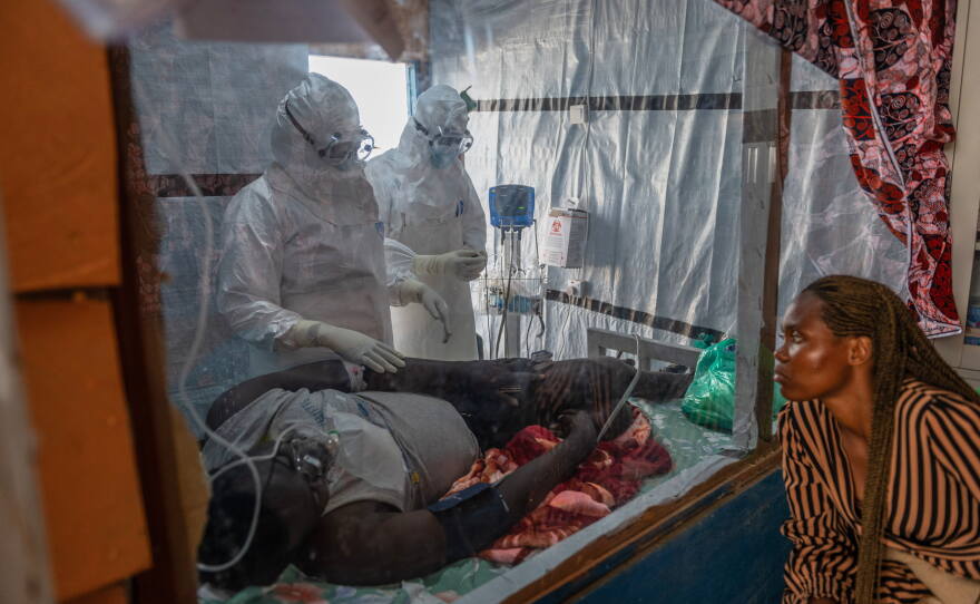 Health workers tend to an Ebola patient at the Rwampara Treatment Center in Ituri, Congo, Thursday, June 18, 2026.