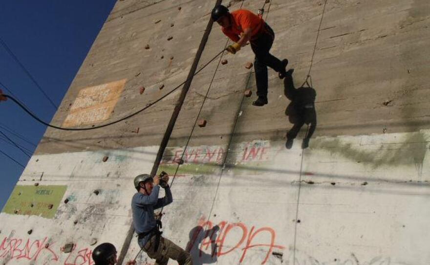 Host Jorge Meraz gives rappelling a try in Mexicali, Baja California, Mexico.
