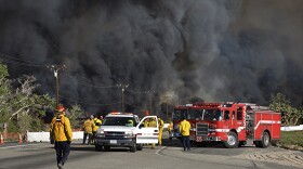 Heavy fire envelops Highway 138 at Hess Road in Phelan as firefighters battle the Blue Cut wildfire spreading through San Bernardino County, Aug. 17, 2016.