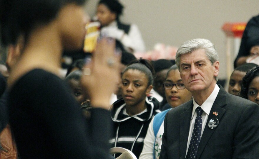 Gov. Phil Bryant watches members of the Anderson United Methodist Church Youth Dance Ministry perform during the First Annual Teenage Pregnancy Prevention Summit in Jackson, Miss., in December 2012.