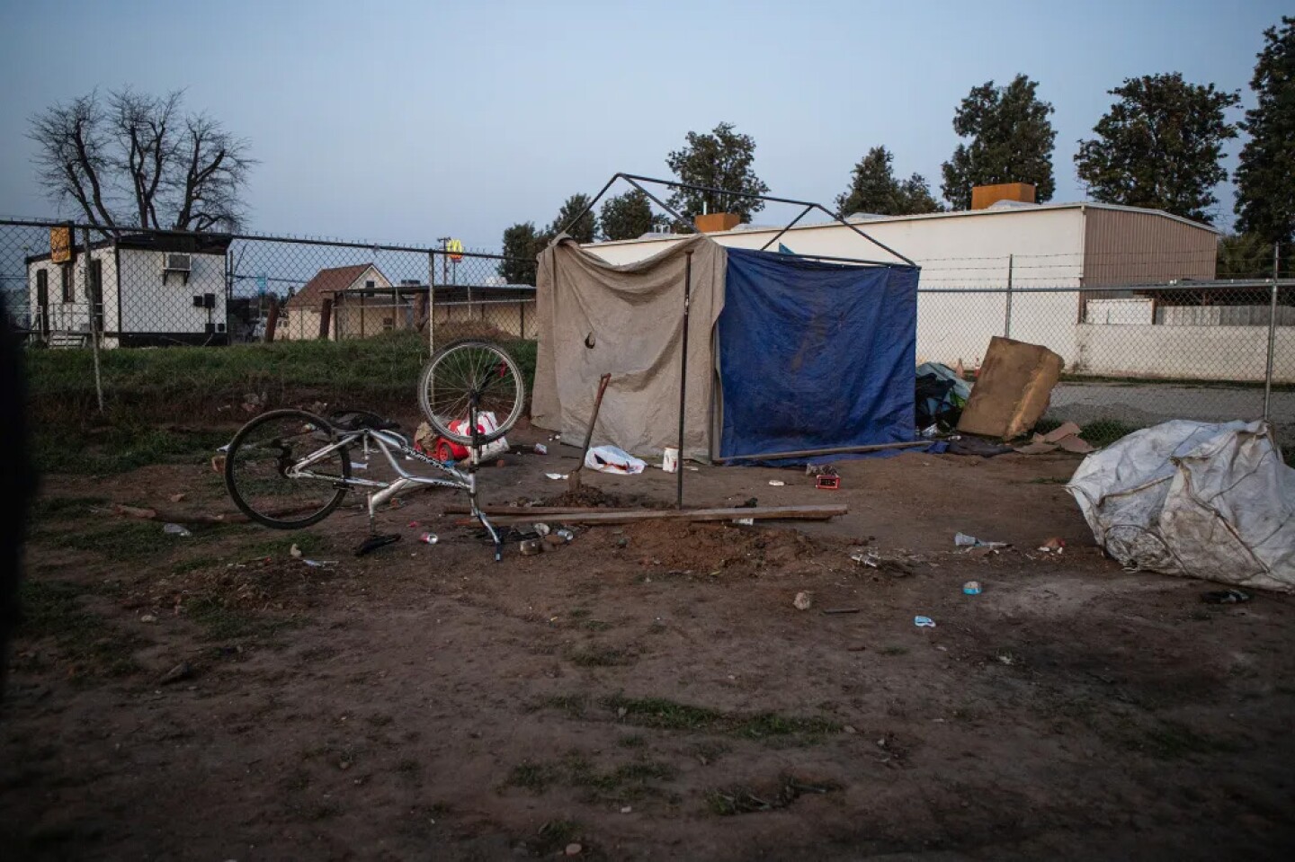 A homeless encampment located on a dirt lot in West Fresno on Jan. 30, 2025.