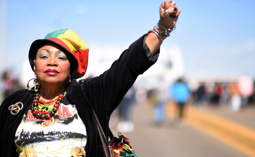 Mercedes Binns, who has been to Selma 17 times because of its civil rights history, walks on the Edmund Pettus Bridge, on Sunday in Selma, Ala.