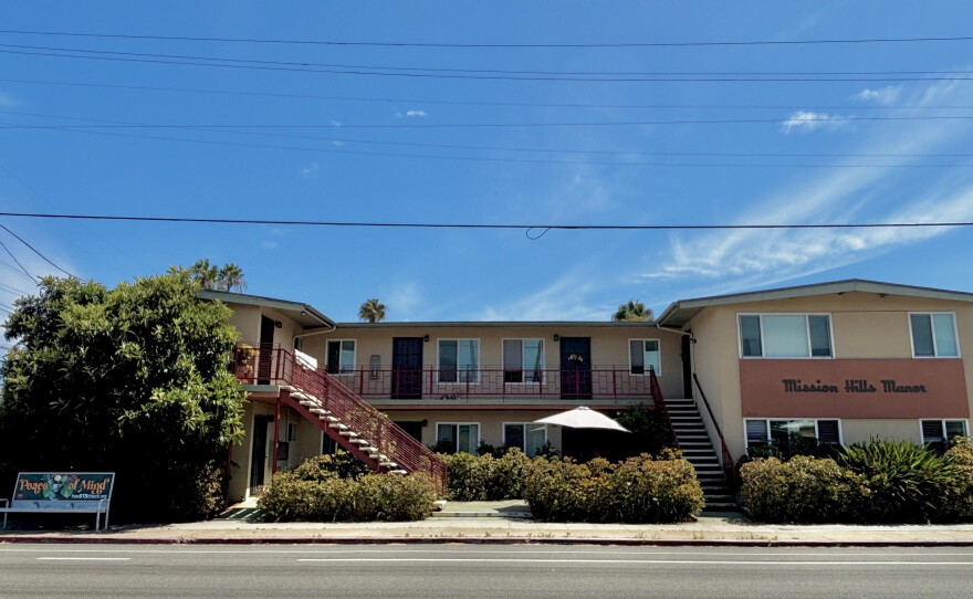 A bus stop sits in front of a small apartment building in Mission Hills, July 24, 2026.