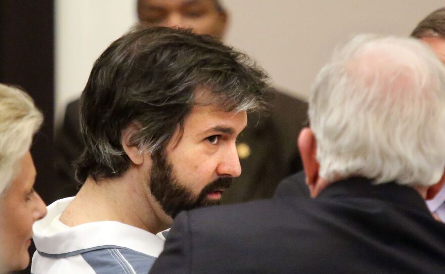 Former North Charleston police Officer Michael Slager talks with his attorney before a hearing in front of Judge Clifton Newman on Monday.