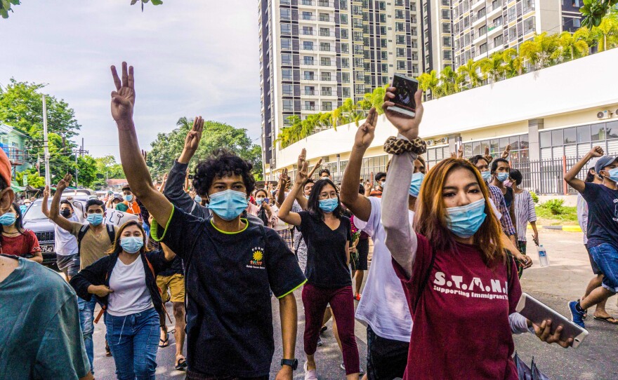 Protesters make the three-finger salute during a demonstration against the military coup in Yangon last month.