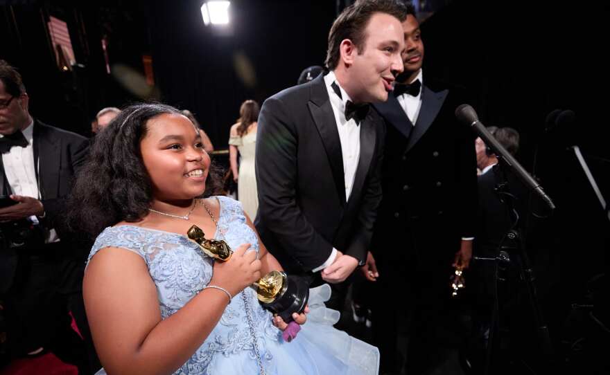 Portia Grieger, a violinist featured in "The Last Repair Shop," and Ben Proudfoot and Kris Bowers accept the Oscar® for Documentary Short Film during the live ABC telecast of the 96th Oscars® at the Dolby® Theatre at Ovation Hollywood on Sunday, March 10, 2024.