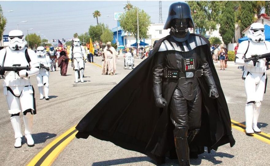 Sam Newcomer, a member of the Southern California Garrison of the 501st Legion, marches as Darth Vader leading his Stormtroopers in the Rosemead Fourth of July parade.
