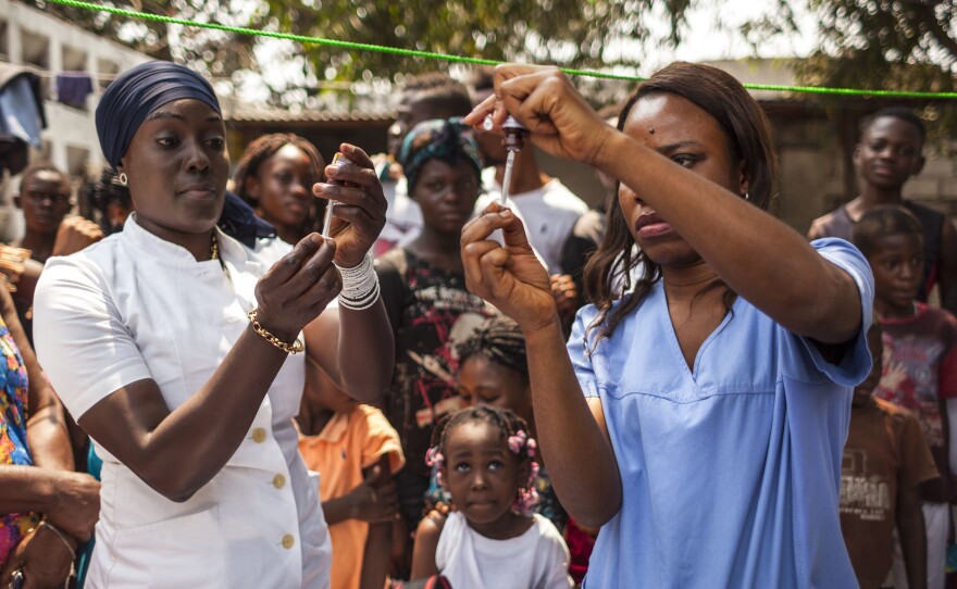 Health workers during the first day of the yellow fever vaccination campaign in Kinshasa, capital of the Democratic Republic of Congo, on August 17.