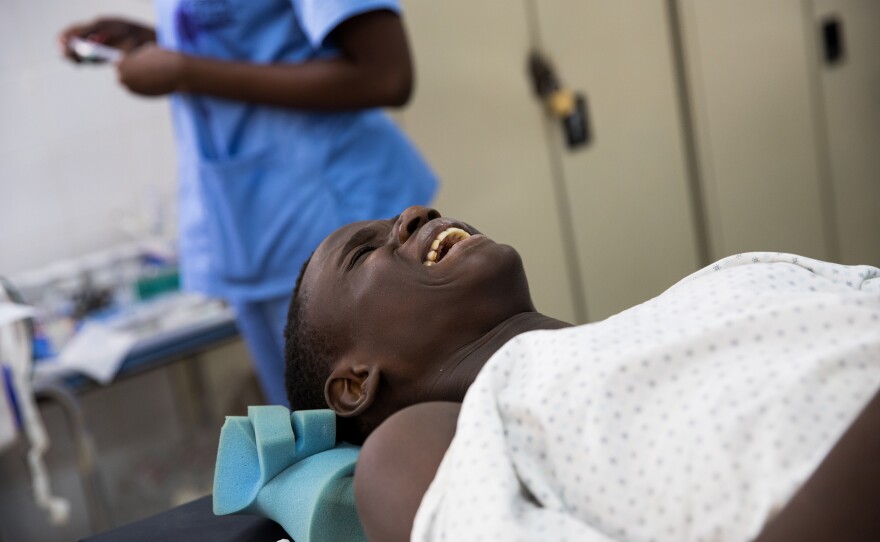 David Kamara, 14, broke his knee in a soccer game. Here he's undergoing knee surgery. Marenah says the boy's knee is going to be "very sore" after the anesthesia wears off.