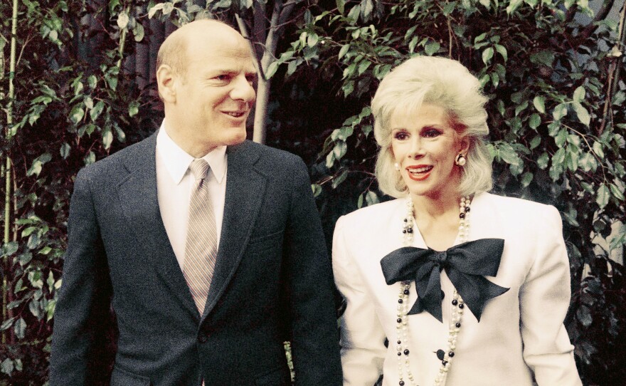 Rivers and Fox Chairman Barry Diller arrive for a news conference in Los Angeles to announce her late-night talk show on Fox.