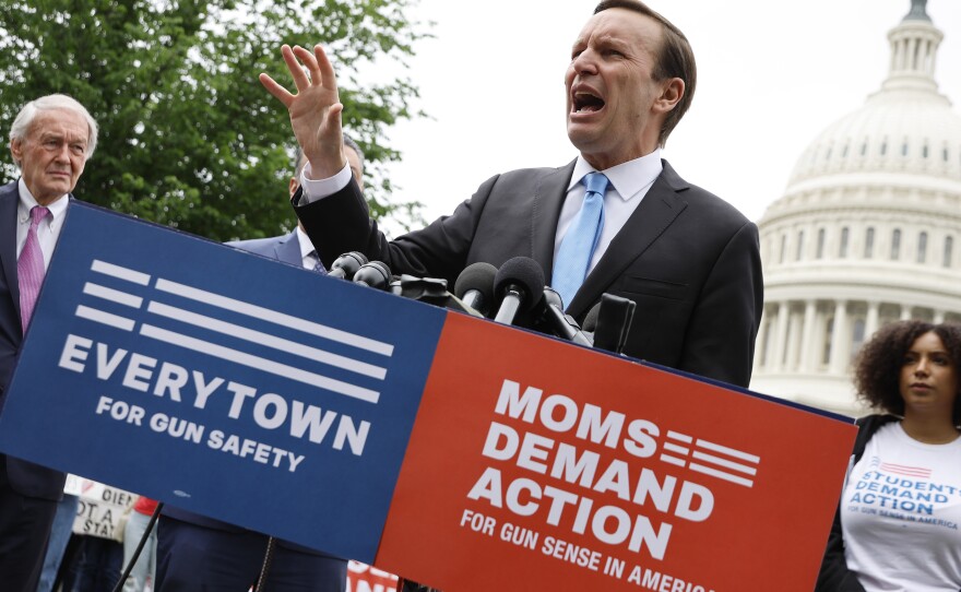 Sen. Chris Murphy, D-Conn., addresses a rally with fellow Senate Democrats and gun control advocacy groups outside the U.S. Capitol on Thursday. Organized by Moms Demand Action, Everytown for Gun Safety and Students Demand Action, the rally brought together members of Congress and gun violence survivors to demand gun safety legislation following mass shootings in Buffalo, N.Y., and Uvalde, Texas.