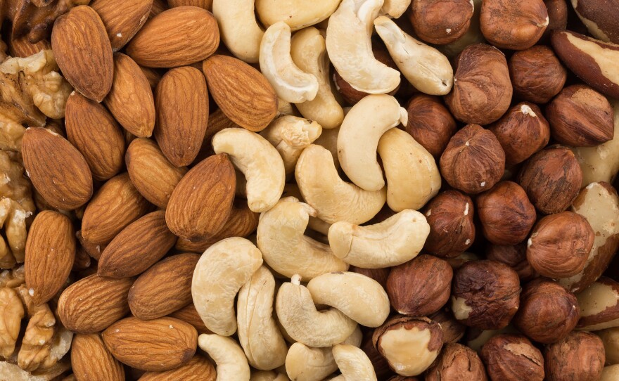U.S. adults put on about a pound a year on average. But people who had a regular nut-snacking habit put on less weight and had a lower risk of becoming obese over time, a new study finds.