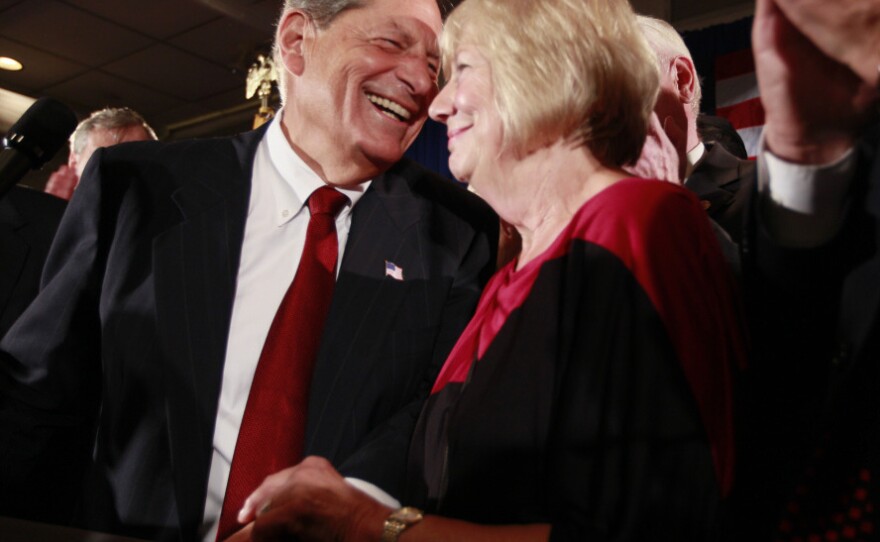Republican Bob Turner, left, with wife Peggy enjoys his upset win, Sept. 13, 2011.