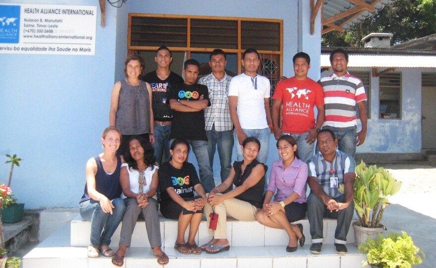 Gena Barnabee, bottom left corner, worked with a team from Health Alliance International to evaluate a new mobile health program.