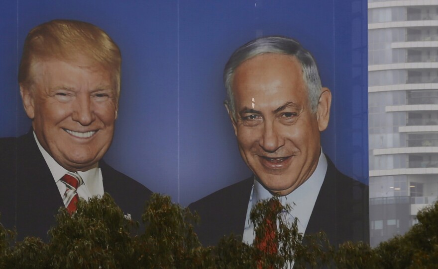 An election campaign billboard in Tel Aviv shows Israeli Prime Minister Benjamin Netanyahu with his close ally President Trump. Seeking re-election under a cloud of criminal investigations, analysts say Netanyahu has been channeling a Trump-style approach, with an angry campaign against perceived domestic enemies.