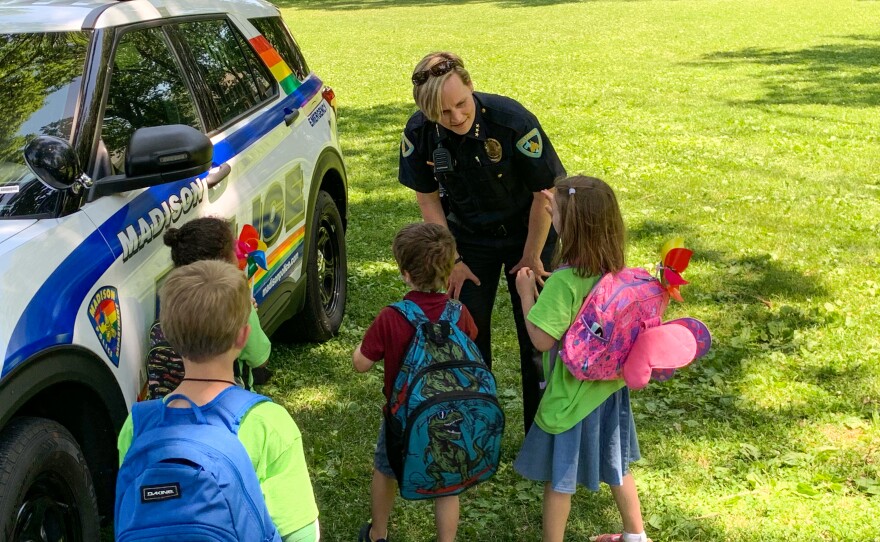 Madison Asst. Police Chief Paige Valenta talks with kids at the Madison Zoo.