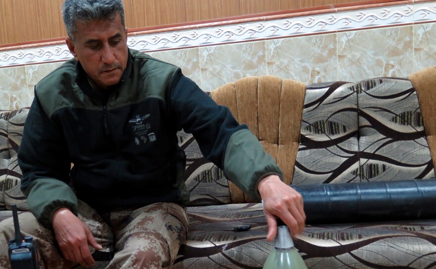 Iraqi Gen. Abdul-Wahab al-Saadi with a locally made mortar. It's almost indistinguishable from Iraqi army mortars apart from the black and white ISIS logo painted on it.