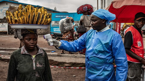 A health worker takes a woman's temperature as part of Ebola screening efforts in Goma, Democratic Republic of Congo. As part of the effort to quash the outbreak, the first patients have been enrolled in a clinical trial to test two drugs against the Bundibugyo strain of the virus that is spreading there. In addition, researchers plan to study whether another drug could protect people exposed to the virus.