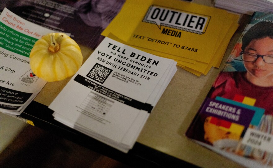 A flyer encouraging voters to vote uncommitted sits at Cairo Coffee and Spotlite, a popular activist gathering spot in Detroit, Mich.