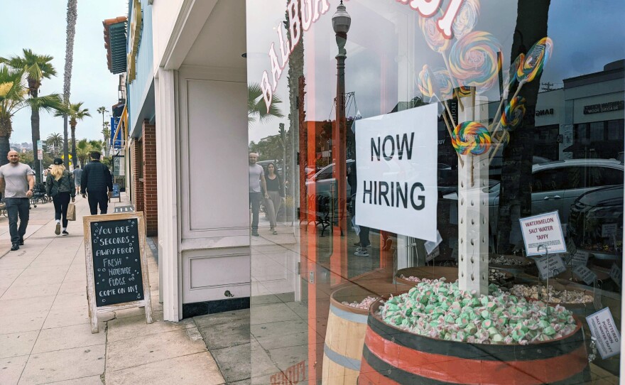 A now hiring sign outside of Balboa Candy store in La Jolla, May 21, 2022.