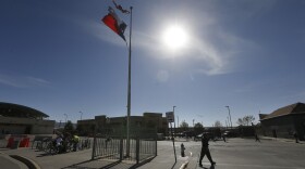 A person crosses the street at a U.S Mexico border crossing in El Paso, Texas, Friday, March 29, 2019.