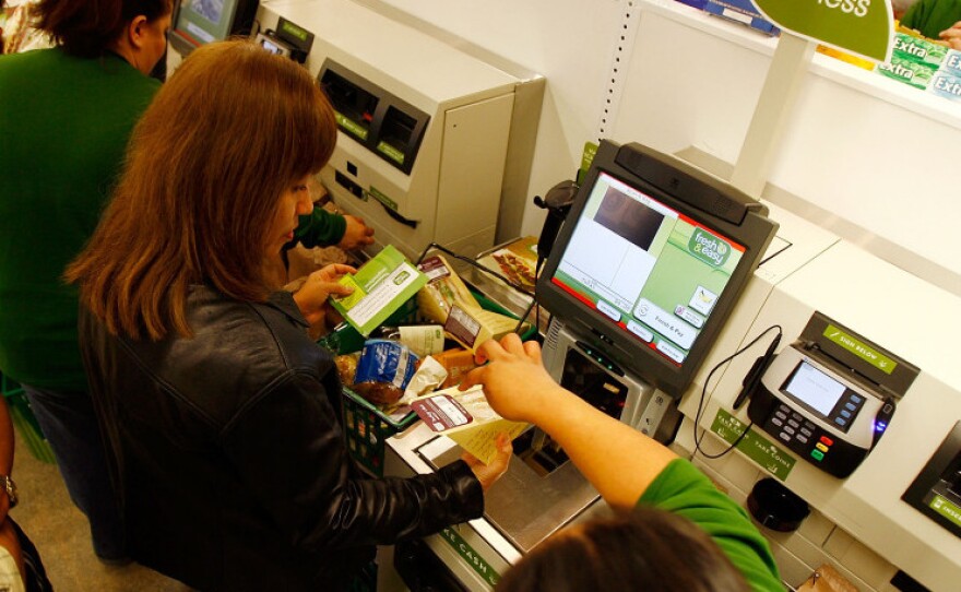 <strong>Shop And Go: </strong>Employees teach shoppers to use self-service checkout stations at a Fresh & Easy grocery store in Los Angeles.