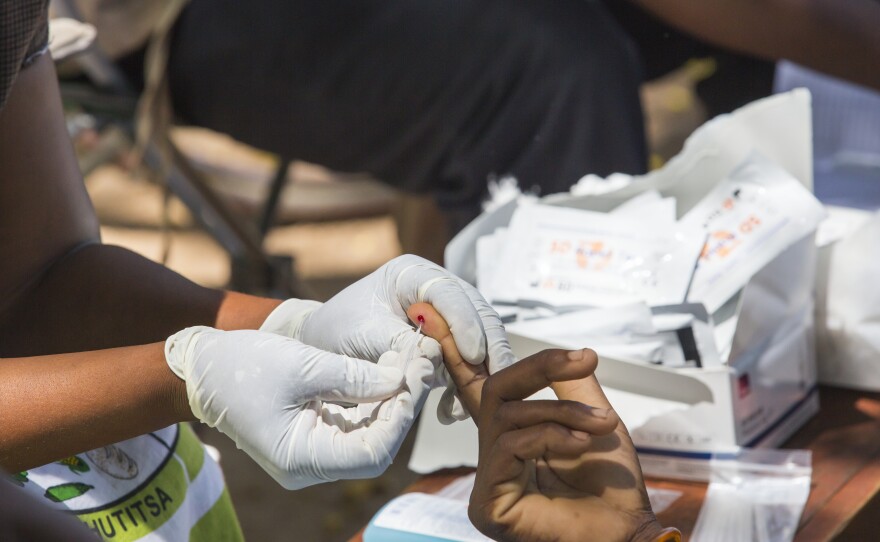 Testing blood for malaria at a Doctors Without Borders clinic in Malawi.
