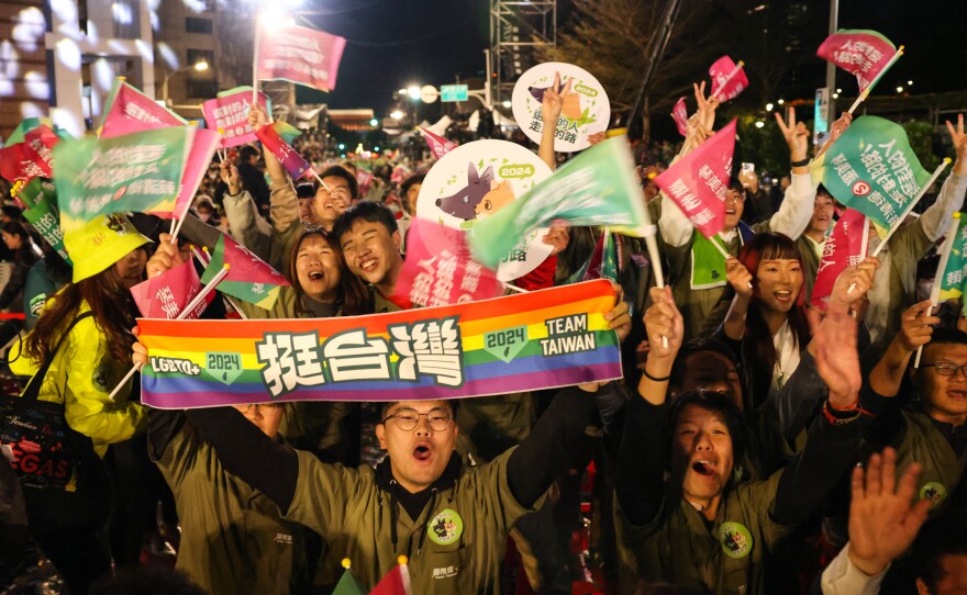 Supporters of Lai Ching-te react after Lai won the presidential election outside the party's headquarters in Taipei on Saturday.