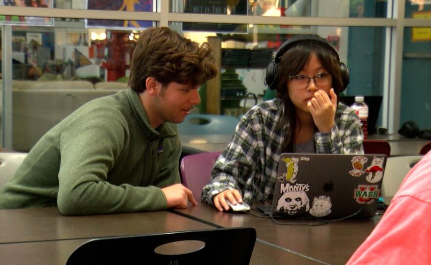 Lorenzo Ametrano, 18, (left) helps an intern with the group coding project at Jacobs High Tech High, San Diego, Calif., June 4, 2024