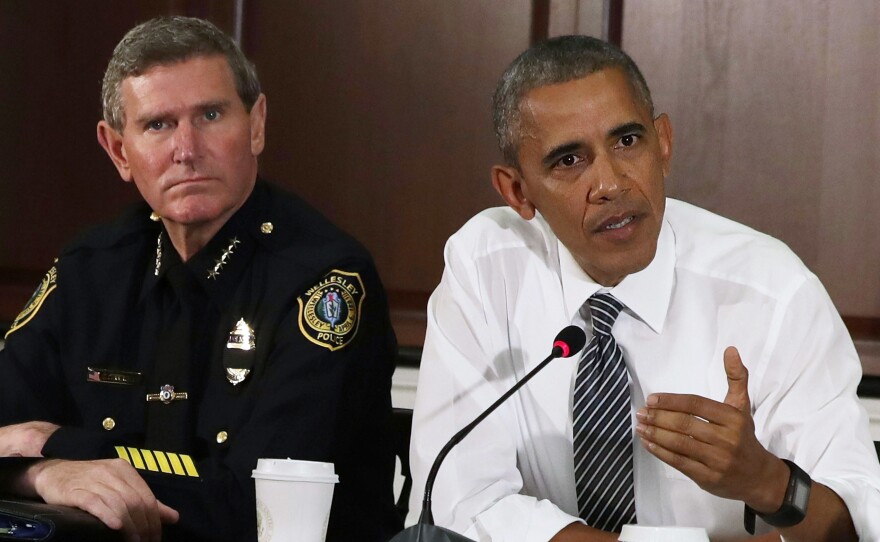 President Obama speaks as Terry Cunningham of the International Association of Chiefs of Police listens July 13 during a conversation on community policing and criminal justice at the Eisenhower Executive Office Building in Washington.