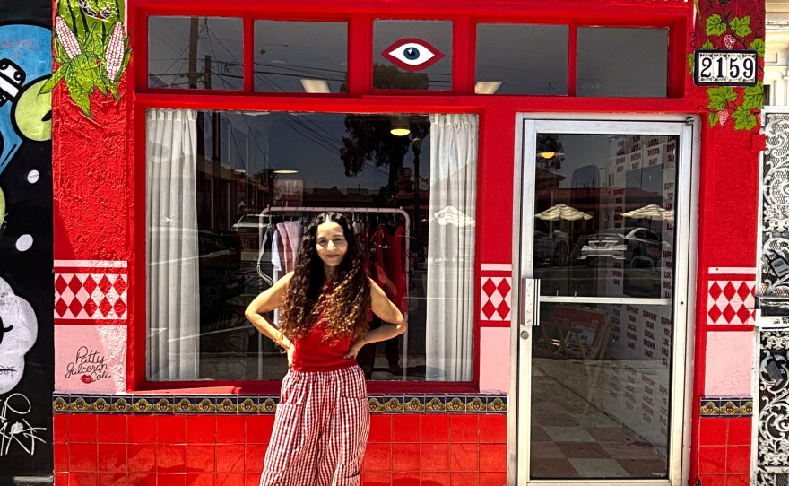 Artist Jiyan Rios Zandi stands outside of her shop, Brown Local Baby, on July 9, 2026.