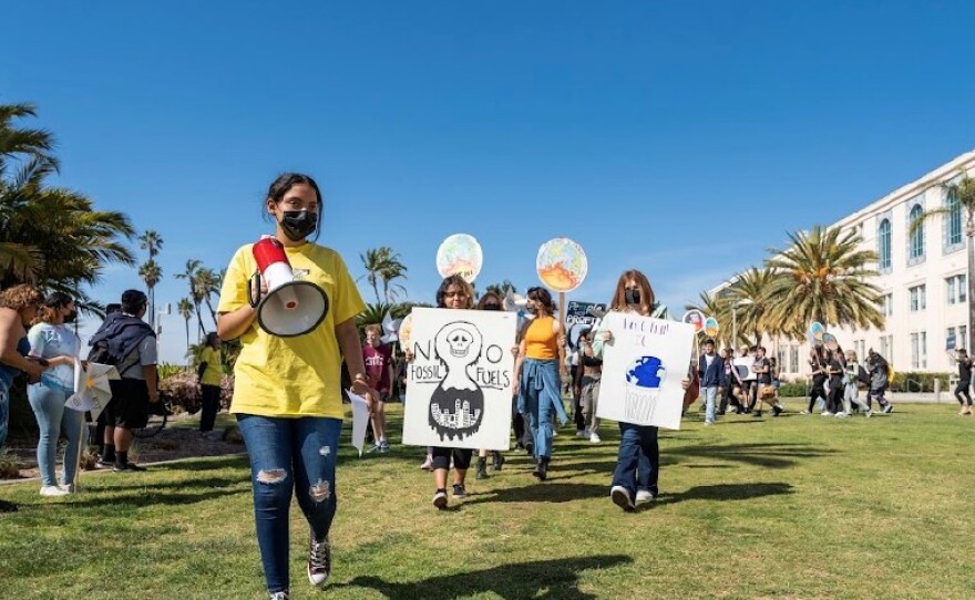 Youth climate activist Natalia Armenta leads a group of youth chanting and marching at a youth climate strike in San Diego, March 25, 2022.<br/>