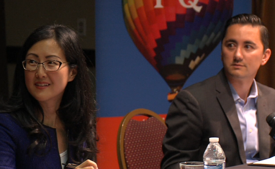 Carol Kim and Chris Cate look at the moderator at a district 6 city council candidate forum in Rancho Peñasquitos, Oct. 15, 2014.