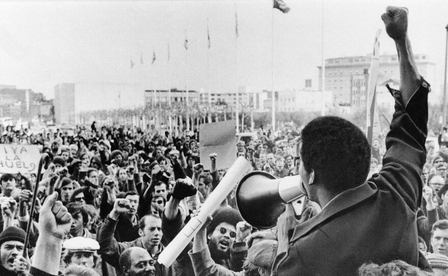 A Black Students Union leader in front of a crowd of demonstrators at San Francisco State College in December 1968.
