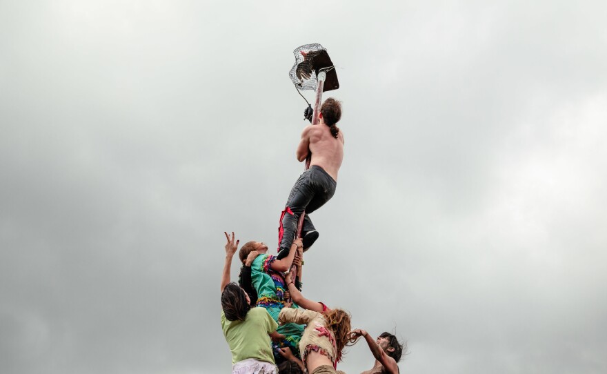 One of the chickens to be captured is placed at the top of greased pole. The Mardi Gras have to find a way to ascend the pole to get the chicken before moving onto the next property.